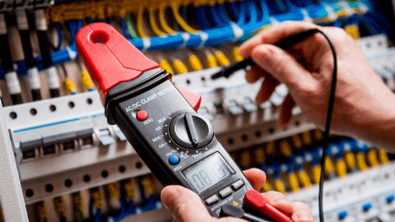 Electronics Engineer Fixing Cables on Server