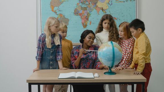 Silver Ipad on White Book Page