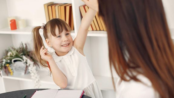 Woman Sitting On Concrete Stairs Using Laptop