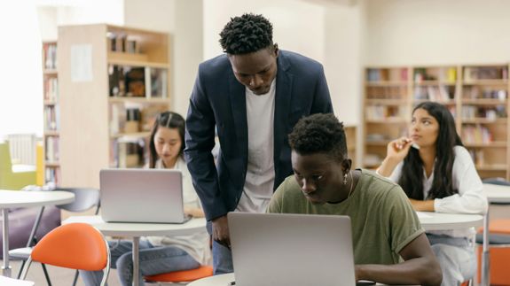 Teacher Helping a Student