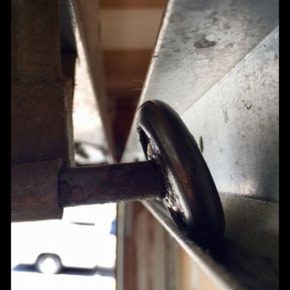What signs indicate that I need roller replacement for my garage door?