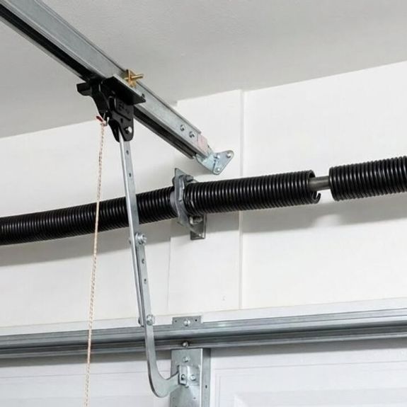 What are the costs associated with torsion spring replacement?