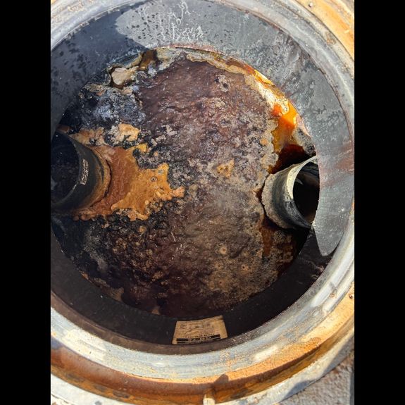 What are the signs that my grease trap needs to be pumped?