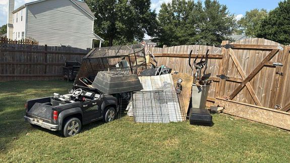 Explore the decay of a rustic wooden shed with broken tools and abandoned materials strewn about.