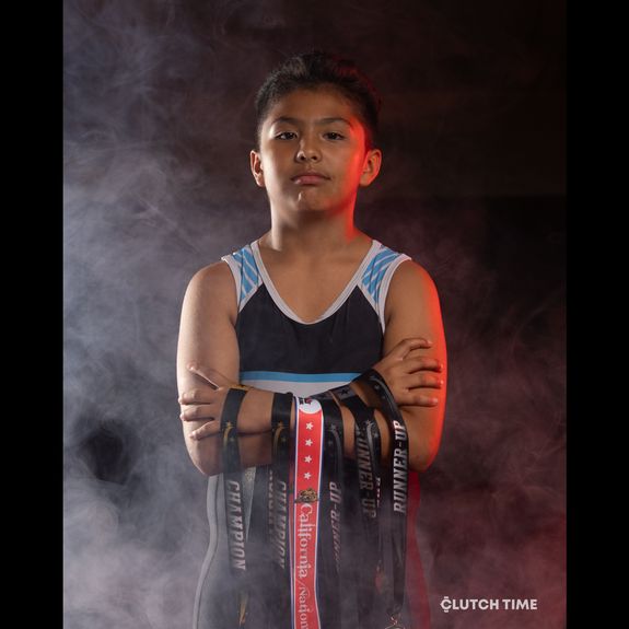 How can I register my child for the MHWC Huskies wrestling program?