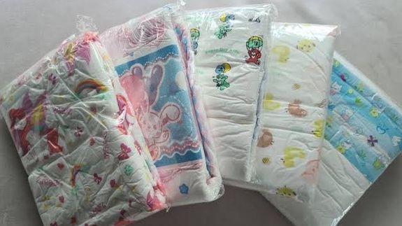 A Woman Kissing a Young Boy