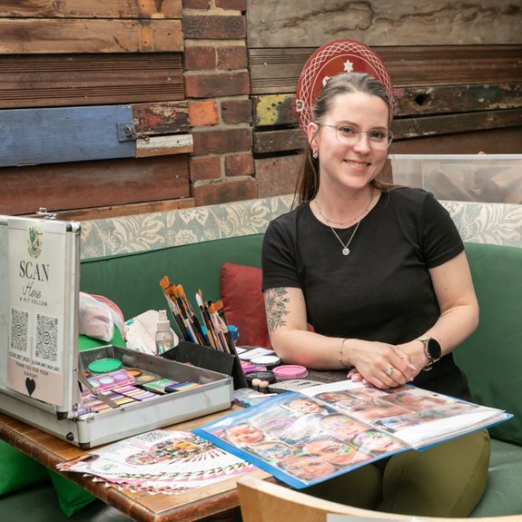 Woman Wearing Grey Dress Holding Heart Balloons