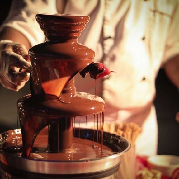Do you provide staff to assist with the chocolate fountain during the event?