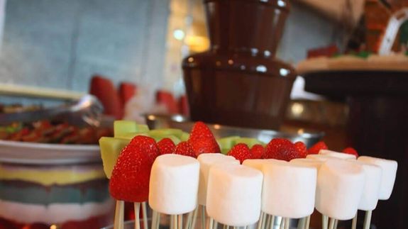 Little Girl Sitting with Her Teddy Bear and Holding Balloons 