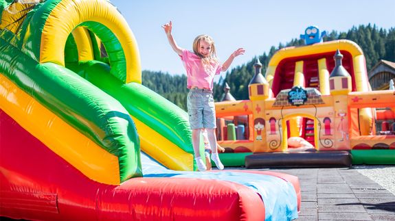 Smiling Woman in Dress and with Balloons