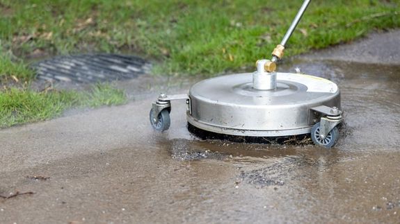 Man Cleaning Stairs on Street