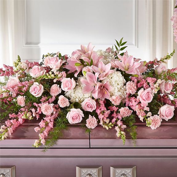 What are tailored funeral sprays and how do they differ from other floral arrangements?