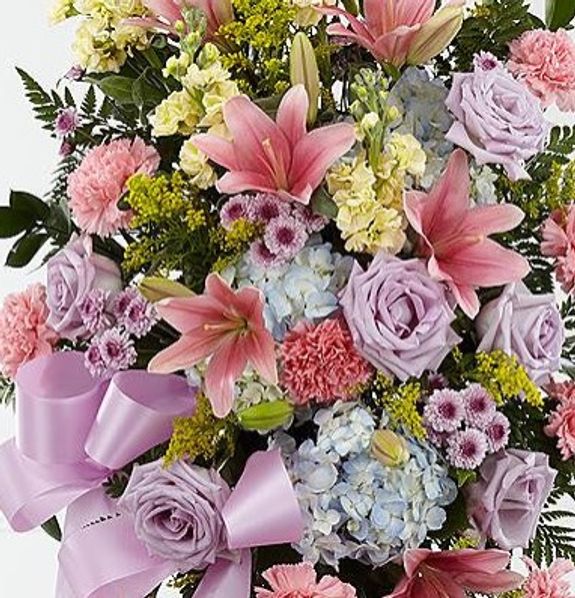 How far in advance should I order a tailored funeral spray?