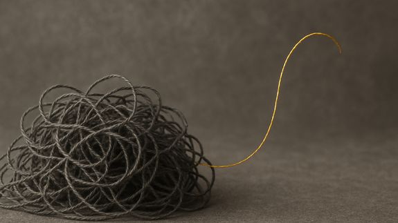 Formal man with tablet giving presentation in office