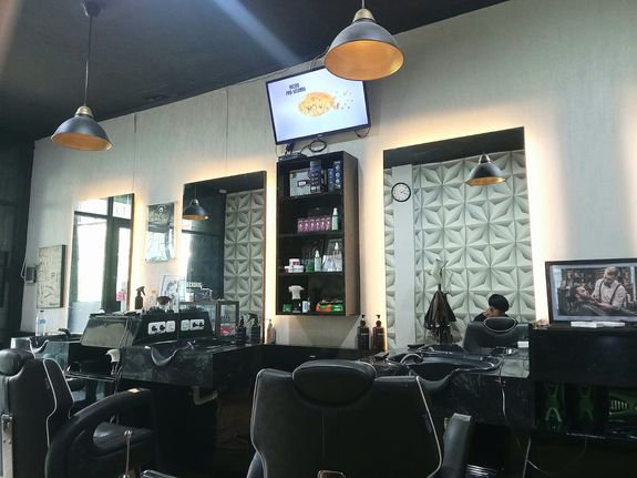 Man in White and Gray Pinstripe Having a Haircut