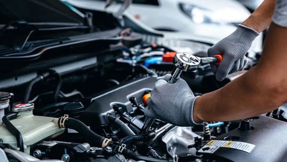 a blue car parked on a road