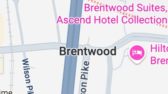 An old, derelict building exterior with scattered debris, showing urban decay.