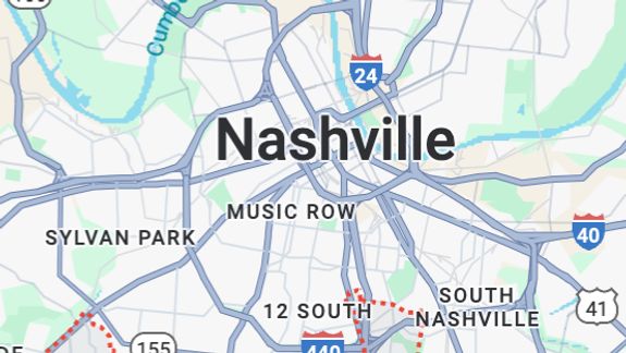 Interior of an abandoned building cluttered with trash and debris, creating a scene of decay and neglect.