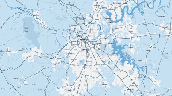 Two volunteers picking up litter outdoors to support environmental conservation.