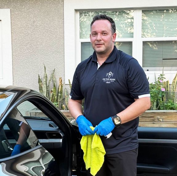 A Person Buffing a Car