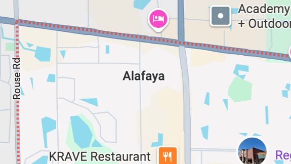 Explore this modern car interior featuring striking orange and black seats with a sleek dashboard.