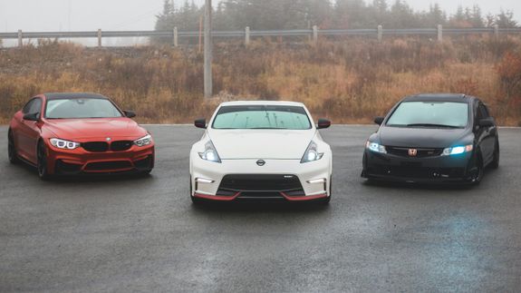 A Person Washing a the Headlight of a Car