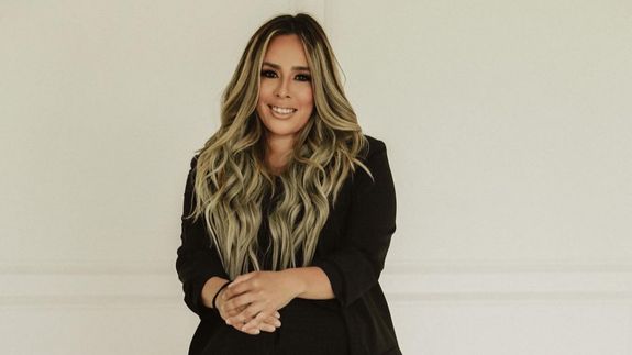 Woman in White Dress Holding Pink Flower Bouquet